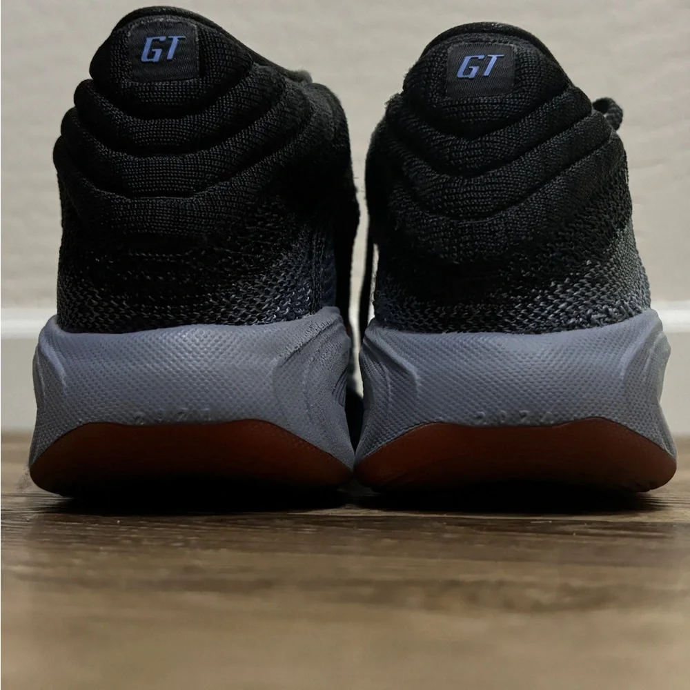 Nike Black Low-Top Sneakers with Orange & Gold Swoosh. Court shoes.